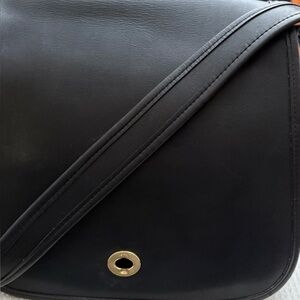 Coach Elegant Black Crossbody Bag with Gold Accent. 
Vintage Stewardess Bag.